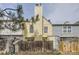 Backyard view of a yellow townhome with a chimney and wooden fence at 1639 S Ivory Cir # C, Aurora, CO 80017