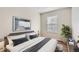 Bedroom features hardwood floors, a window, decor and a bed at 1639 S Ivory Cir # C, Aurora, CO 80017