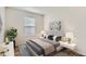 Bedroom boasts modern decor, a window, and stylish lamps at 1639 S Ivory Cir # C, Aurora, CO 80017