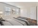 Bright bedroom features two windows and a closet with wood floors at 1639 S Ivory Cir # C, Aurora, CO 80017