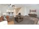Comfortable living area with modern furnishings, a view into the kitchen, and easy access to the stairs at 1639 S Ivory Cir # C, Aurora, CO 80017