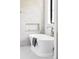 Bright bathroom featuring a modern soaking tub, brushed gold fixtures, and white subway tile at 1680 S Humboldt St, Denver, CO 80210