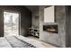 Modern bedroom featuring a fireplace, gray walls, and a large picture window overlooking the property at 1680 S Humboldt St, Denver, CO 80210