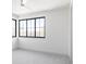 Neutral bedroom with lots of light from large windows offering a view of the mature landscaping at 1680 S Humboldt St, Denver, CO 80210