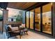 Relaxing covered patio with comfortable seating, an outdoor rug, and views of the backyard at 1680 S Humboldt St, Denver, CO 80210