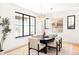 Elegant dining room with large windows, pendant lighting, and seating for six at 1680 S Humboldt St, Denver, CO 80210