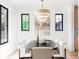 Dining area with black-trimmed windows, modern chandelier, and stylish decor at 1680 S Humboldt St, Denver, CO 80210