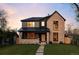 Stunning two-story home with brick and siding, a well-manicured lawn, and a charming walkway at 1680 S Humboldt St, Denver, CO 80210