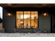 Inviting front porch with seating area and large window offering a glimpse of the interior at 1680 S Humboldt St, Denver, CO 80210