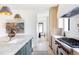 Gourmet kitchen featuring a marble countertop, stainless steel appliances, and sleek cabinetry at 1680 S Humboldt St, Denver, CO 80210