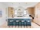 Bright, modern kitchen with a large island, stylish stools, and stainless steel appliances at 1680 S Humboldt St, Denver, CO 80210