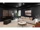 Modern living room showcasing dark walls and ceiling with a large sectional sofa at 1680 S Humboldt St, Denver, CO 80210