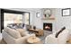 Spacious living room with fireplace, comfortable seating, and large sliding doors to the outside patio at 1680 S Humboldt St, Denver, CO 80210