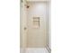Modern shower featuring light wooden paneling and a built-in shelf at 1680 S Humboldt St, Denver, CO 80210
