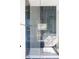Modern shower featuring gray subway tiles, brushed gold fixtures, and a seamless glass enclosure at 1680 S Humboldt St, Denver, CO 80210