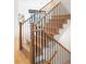 Modern staircase with wooden treads and a black metal railing at 1680 S Humboldt St, Denver, CO 80210