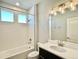 Well-lit bathroom with subway-tiled shower, modern vanity, and bright fixtures for comfortable living at 17569 Cerberus Ct, Monument, CO 80132