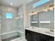 Sleek bathroom featuring tiled walk-in shower, and double sink vanity for modern, luxurious living at 17569 Cerberus Ct, Monument, CO 80132