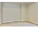 Neutral bedroom space with carpet, base trim, and electrical outlets on the wall at 17569 Cerberus Ct, Monument, CO 80132