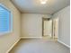 Bedroom with neutral walls, carpet, window and view to doorway leading into adjacent space at 17569 Cerberus Ct, Monument, CO 80132