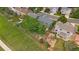 Aerial view of a home featuring a spacious backyard, a play area, and mature trees at 9869 Burberry Way, Highlands Ranch, CO 80129