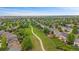 Beautiful aerial view of a neighborhood with green spaces and a walking trail in a suburban community at 9869 Burberry Way, Highlands Ranch, CO 80129
