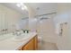 Well-lit bathroom featuring a large mirror, single sink, and combination tub and shower at 9869 Burberry Way, Highlands Ranch, CO 80129