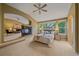 Serene main bedroom with ensuite access, fireplace, and large windows offering backyard views at 9869 Burberry Way, Highlands Ranch, CO 80129