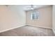 Bright bedroom features neutral paint, carpet flooring, a ceiling fan and a large window with blinds at 14952 Vienna Cir, Parker, CO 80134