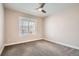 Bedroom featuring carpet floors and a large window at 14952 Vienna Cir, Parker, CO 80134