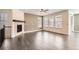 Bright living room featuring hardwood floors, a cozy fireplace, and plenty of natural light at 14952 Vienna Cir, Parker, CO 80134