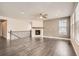 Inviting living space with hardwood floors, a corner fireplace, and abundant windows for natural light at 14952 Vienna Cir, Parker, CO 80134