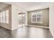 Bright living room with hardwood floors and sliding glass doors leading to the backyard and patio at 14952 Vienna Cir, Parker, CO 80134
