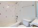 Clean white bathroom with bathtub and shower combo with matching tile at 15800 E 121St Ave # 3J, Brighton, CO 80603