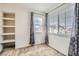 Bedroom with window, carpet, and built-in shelves at 15800 E 121St Ave # 3J, Brighton, CO 80603