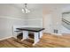 Built-in dining nook with a dark wood table and white bench seating at 15800 E 121St Ave # 3J, Brighton, CO 80603