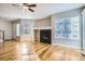 Living room with hardwood floors, fireplace and lots of natural light at 15800 E 121St Ave # 3J, Brighton, CO 80603