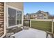 Private patio area with sliding glass doors and snow covered ground at 15800 E 121St Ave # 3J, Brighton, CO 80603