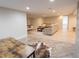 Basement with a recreation area featuring hardwood floors and neutral decor at 740 Deer Clover Cir, Castle Pines, CO 80108
