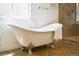 Claw foot bathtub in a bathroom with a glass shower and a granite sink at 740 Deer Clover Cir, Castle Pines, CO 80108