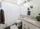 Bathroom featuring granite countertop, black tile floors, and shower at 740 Deer Clover Cir, Castle Pines, CO 80108