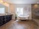 Bathroom featuring free-standing tub, walk-in shower and modern finishes at 740 Deer Clover Cir, Castle Pines, CO 80108