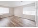 Bedroom featuring ample natural light, hardwood floors, and modern design at 740 Deer Clover Cir, Castle Pines, CO 80108