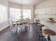 Cozy dining area bathed in natural light, complemented by modern decor and a view to the kitchen at 740 Deer Clover Cir, Castle Pines, CO 80108