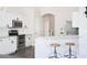 Bright kitchen featuring stainless steel appliances, white cabinetry, and a breakfast bar for casual dining at 740 Deer Clover Cir, Castle Pines, CO 80108