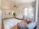 Spacious living room with hardwood floors, neutral colors, and seamless flow to the dining area at 740 Deer Clover Cir, Castle Pines, CO 80108