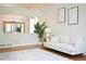 Bright living room featuring a white sofa and modern decor at 740 Deer Clover Cir, Castle Pines, CO 80108