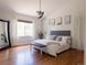 Serene main bedroom boasts hardwood floors, ceiling fan, natural light, and modern decor creating a relaxing space at 740 Deer Clover Cir, Castle Pines, CO 80108