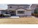 An inviting backyard patio, complete with a hot tub, offers a great outdoor retreat at 11025 Watermark St, Parker, CO 80134