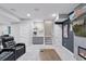 Finished basement featuring a wet bar with a small sink, refreshment center, and leather seating at 11025 Watermark St, Parker, CO 80134